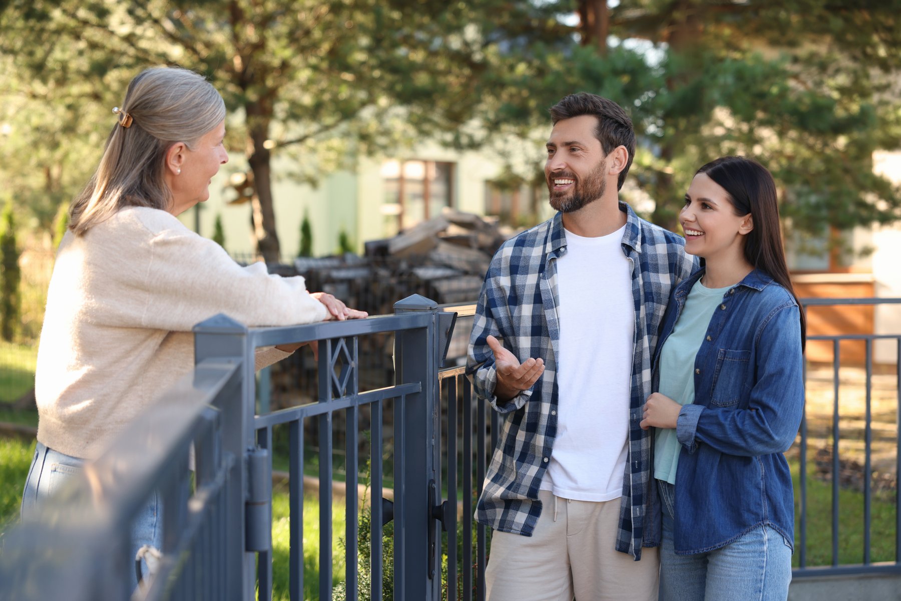 Neighbors chatting outside a home — a natural referral moment